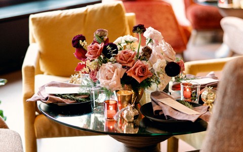 lounge area with beautiful roses on coffee table centerpiece