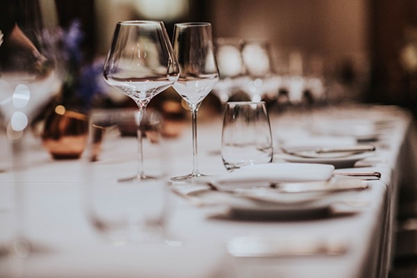 table settings with empty wine glasses