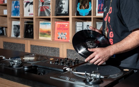 a man holding a vinyl record