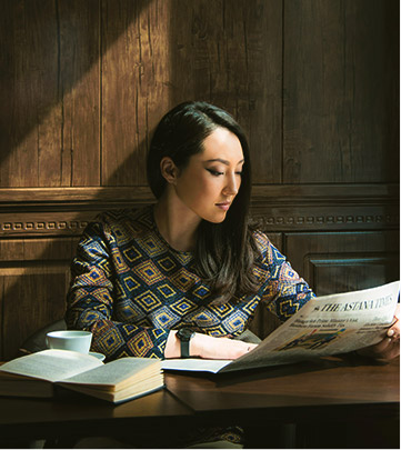 woman reading newspaper