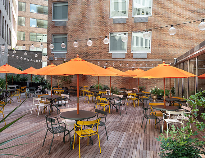 outdoor patio with orange umbrellas 