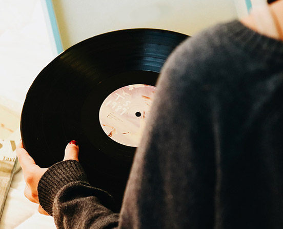 person holding a record