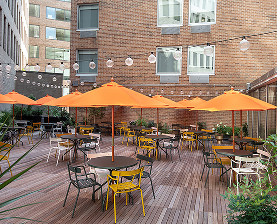 outdoor patio with orange umbrellas 
