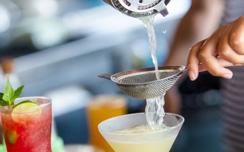 Person pouring cocktail